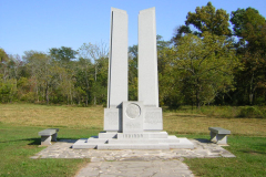 Two monoliths stand on a pedestal and base, surrounded by a patio and walkway. The Indiana State Seal is incised into the lower front face, between the monoliths. Monument honors soldiers from Indiana who, with the Army of the Potomac, participated in the Gettysburg campaign. It marks the site of the charge of the 27th Indiana Infantry on the morning on July 3, 1863. The 27th Indiana was one of seven regiments from that state at Gettysburg.